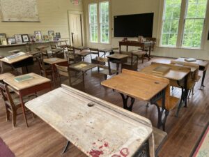 Wooden desks in classroom, Surry, Maine.